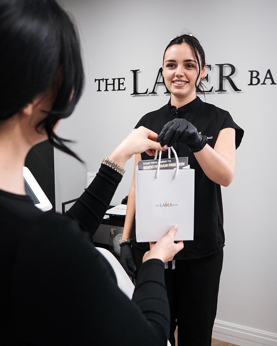 The Laser Base team member with a client