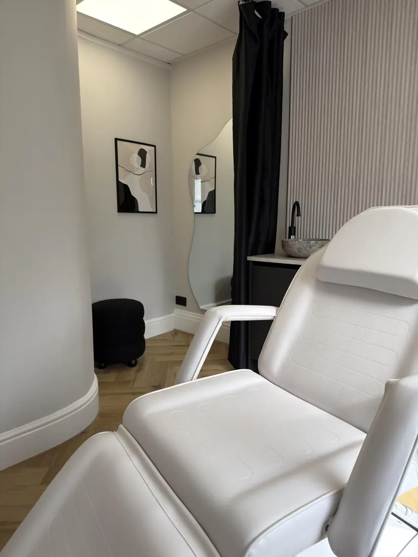 Ad hoc treatment room with electric bed and curtained changing area