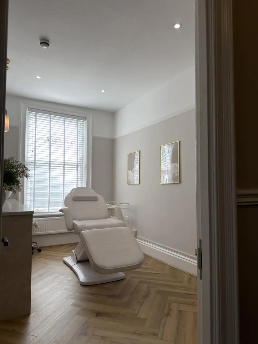 Electric beauty bed beside a large sash window