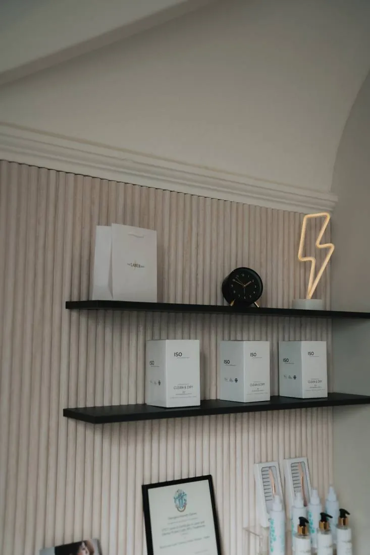 Shelf detail with retail stock and the neon lightning bolt
